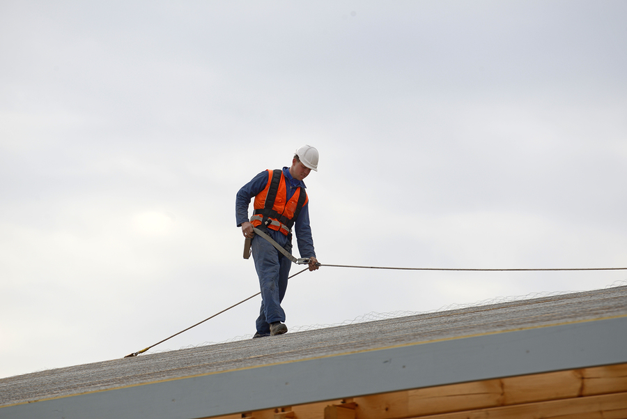professional roofing contractor roofers during work